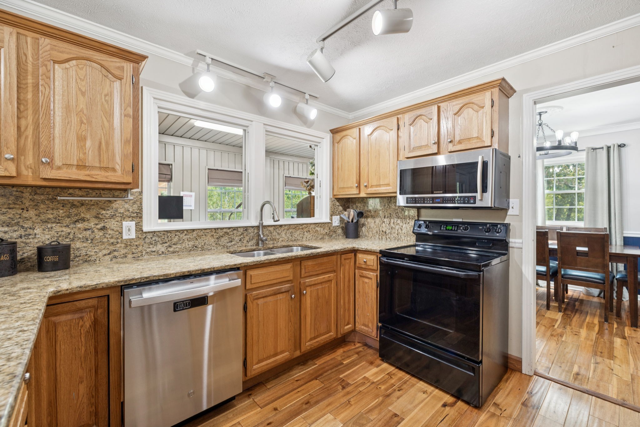 2151 Bakerville Road Waverly, TN 37185 - Photo 22 of 67 a kitchen with stainless steel appliances granite countertop a stove sink and microwave