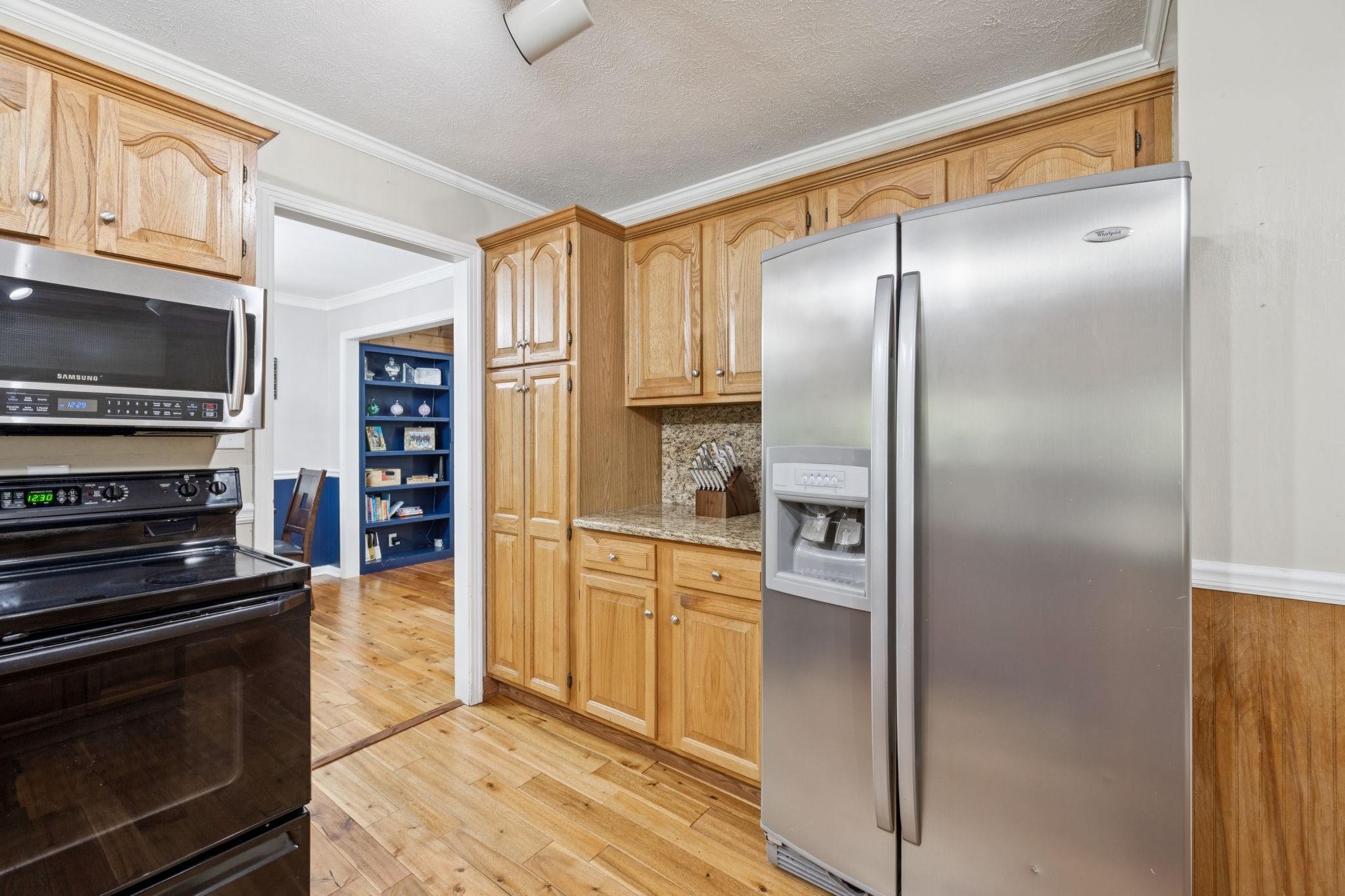 2151 Bakerville Road Waverly, TN 37185 - Photo 23 of 67 a kitchen with stainless steel appliances granite countertop a refrigerator and a stove top oven