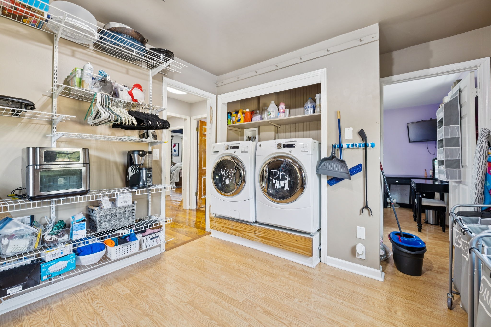2151 Bakerville Road Waverly, TN 37185 - Photo 38 of 67 a utility room with dryer washer and a fireplace