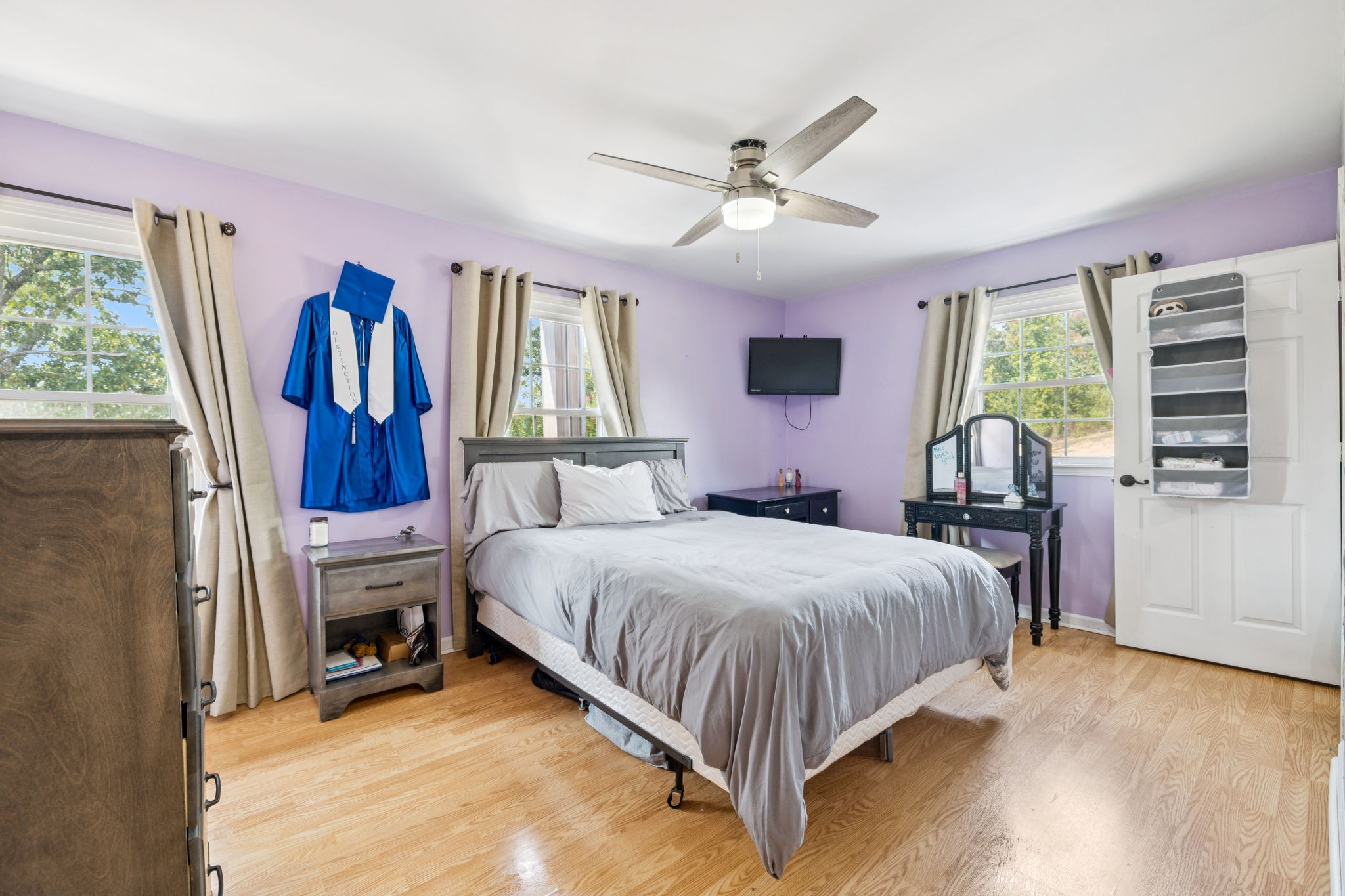 2151 Bakerville Road Waverly, TN 37185 - Photo 39 of 67 a bedroom with a bed next to a window and a flat screen tv