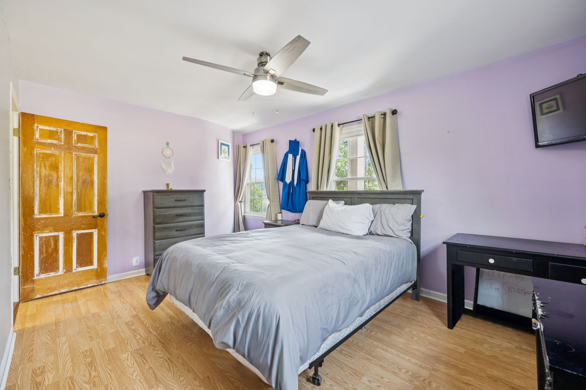 2151 Bakerville Road Waverly, TN 37185 - Photo 40 of 67 a bedroom with a bed and a chandelier