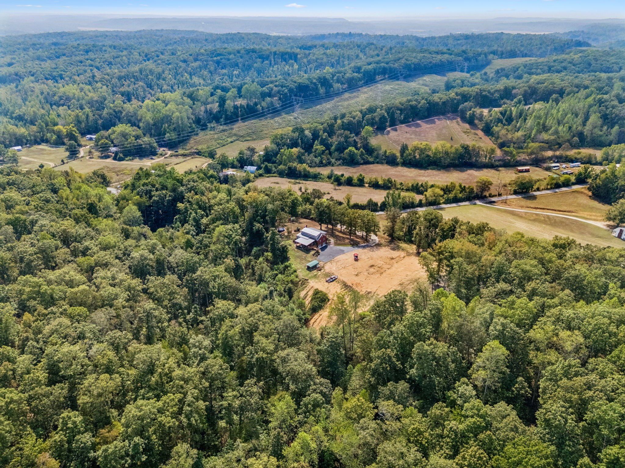 2151 Bakerville Road Waverly, TN 37185 - Photo 57 of 67 an aerial view of residential houses with outdoor space and trees