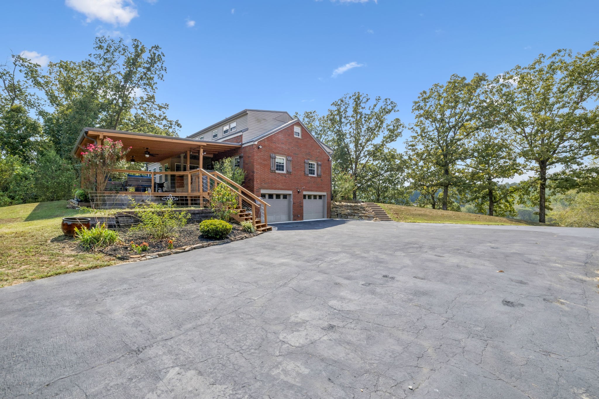 2151 Bakerville Road Waverly, TN 37185 - Photo 6 of 67 a front view of a house with a yard and a garage