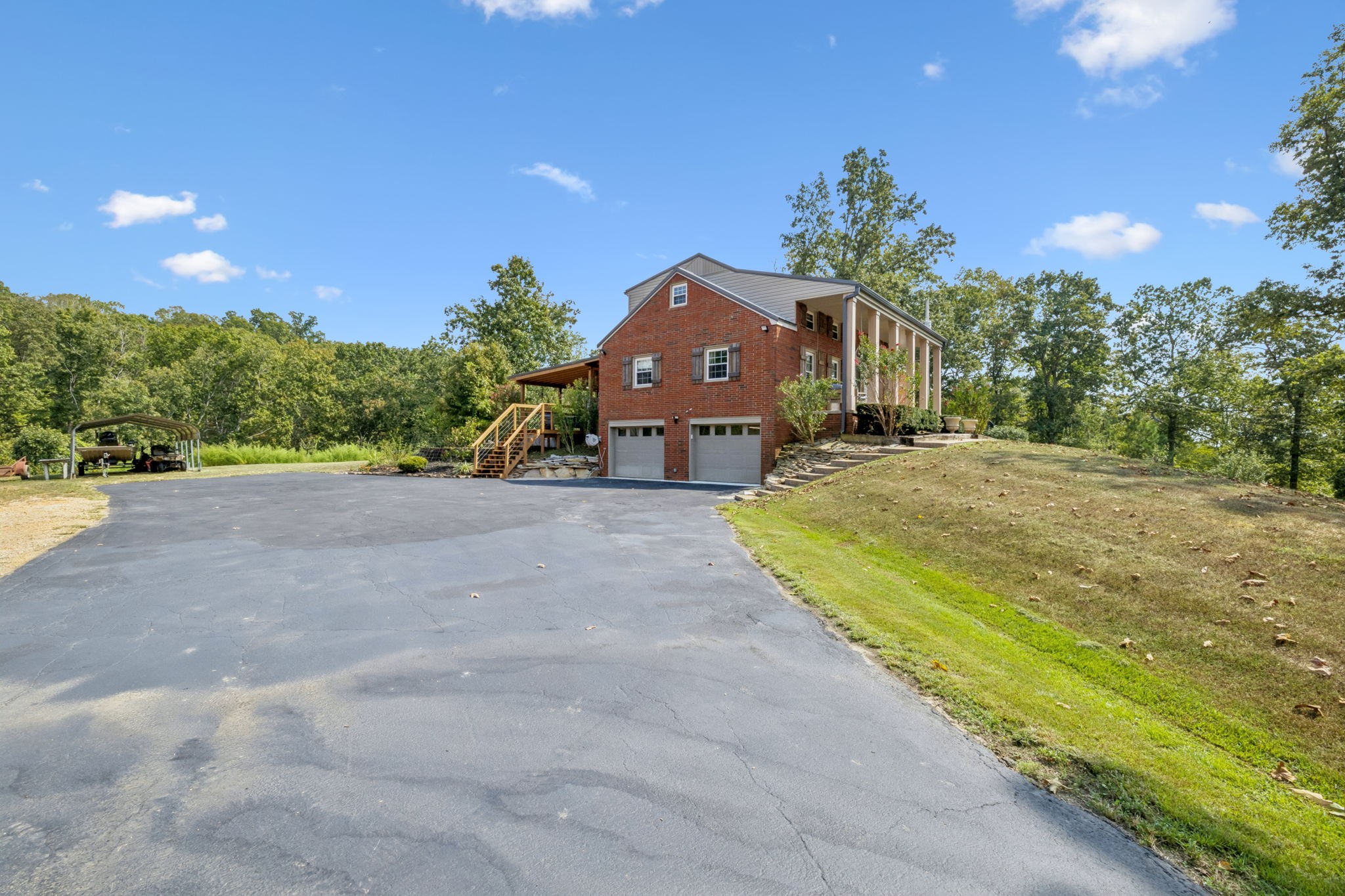 2151 Bakerville Road Waverly, TN 37185 - Photo 7 of 67 a front view of a house with a yard and garage