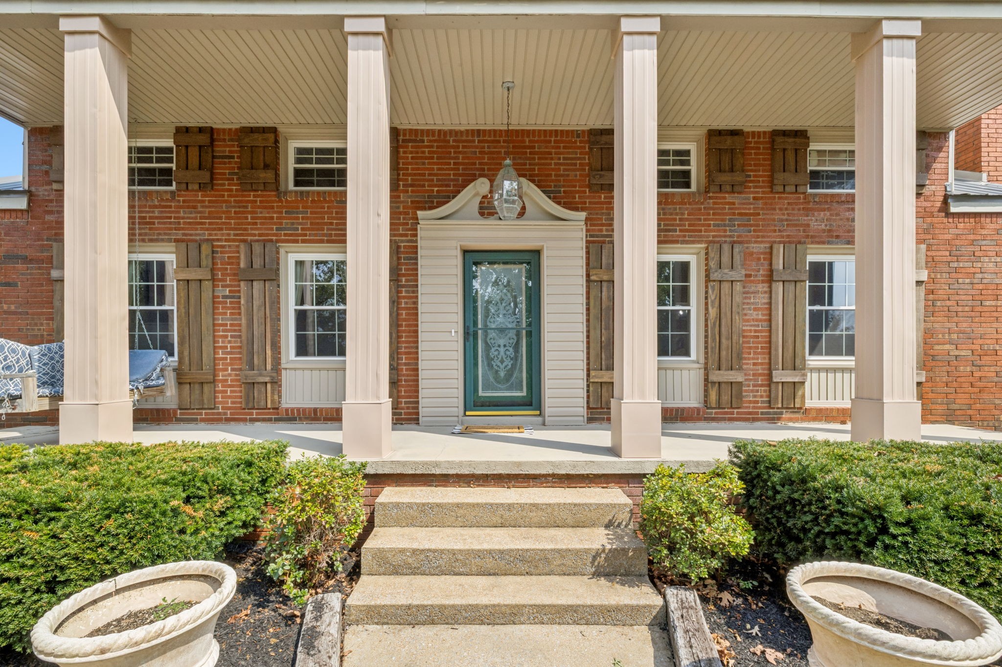 2151 Bakerville Road Waverly, TN 37185 - Photo 9 of 67 a front view of a house with a garden