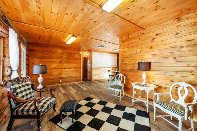 a view of a patio with a dining table and chairs
