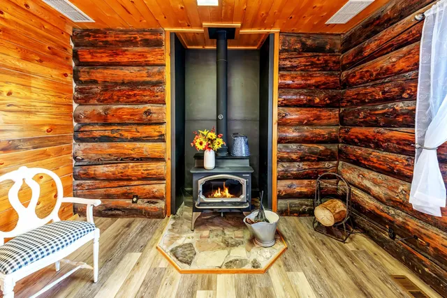 a backyard of a house with table and chairs
