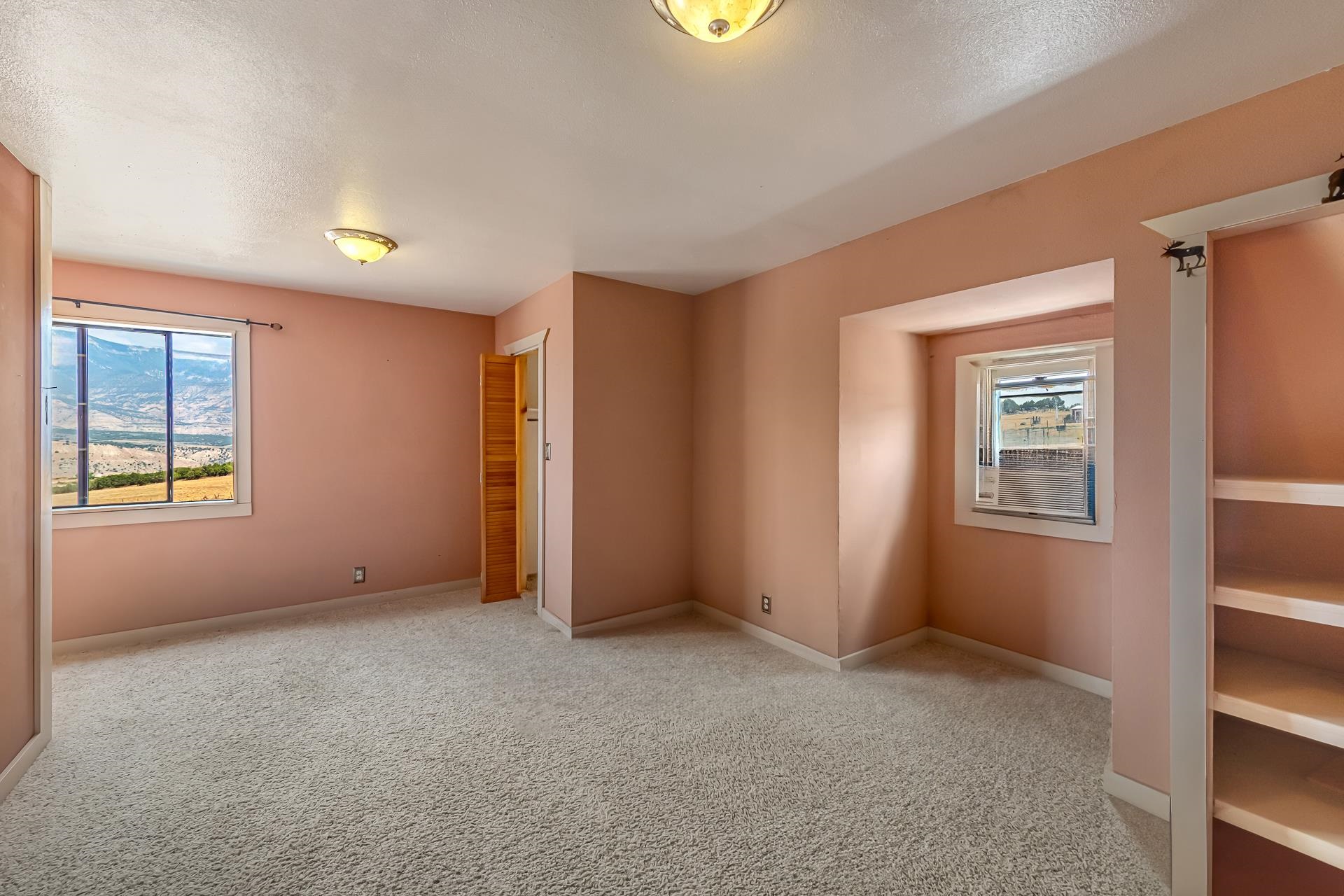 6194 County Road 320 Rifle, CO 81650 - Photo 23 of 42 a view of an empty room with a window