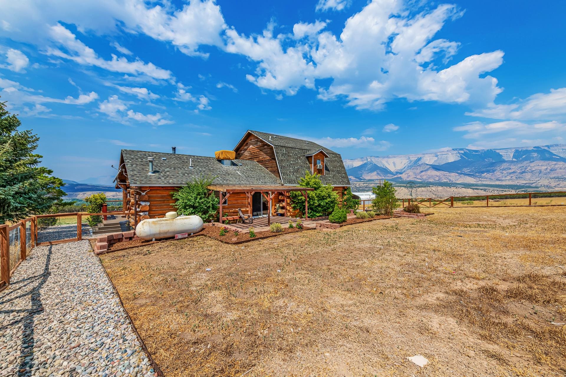 6194 County Road 320 Rifle, CO 81650 - Photo 27 of 42 a view of a house with a patio