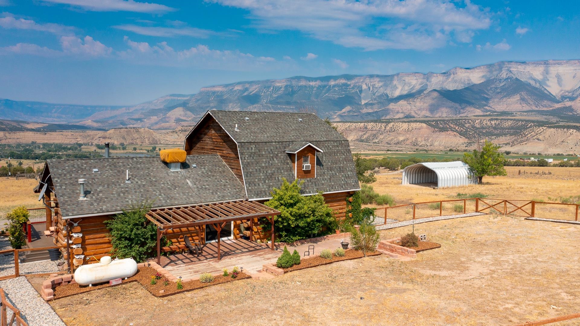6194 County Road 320 Rifle, CO 81650 - Photo 31 of 42 an aerial view of a house with a garden and mountain view