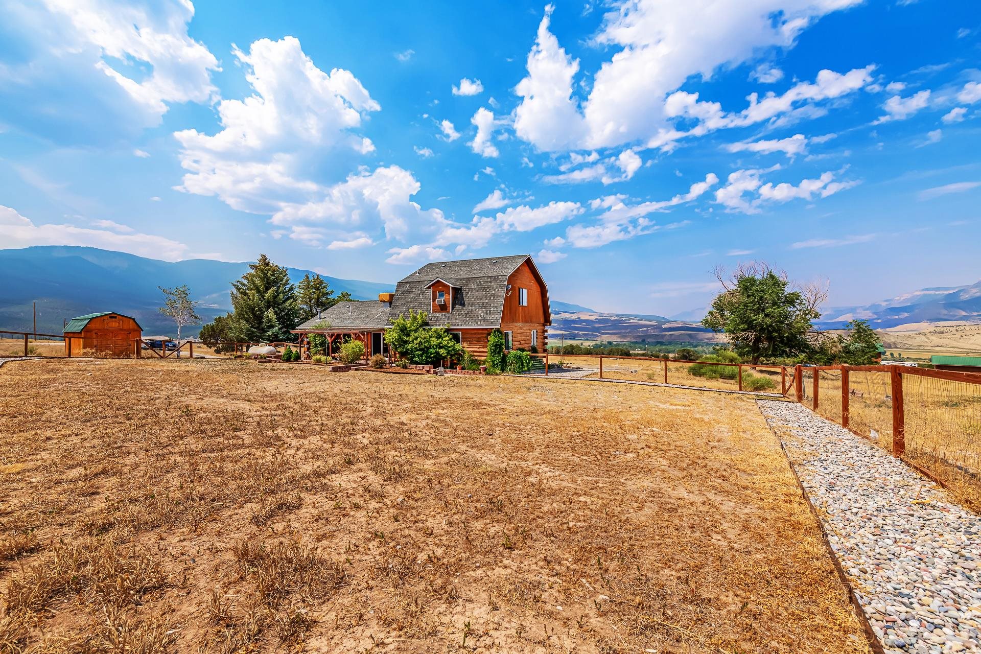 6194 County Road 320 Rifle, CO 81650 - Photo 37 of 42 a view of swimming pool with outdoor seating and lake