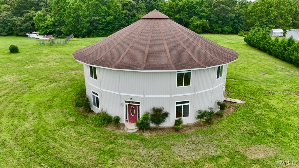 a aerial view of a house with a yard