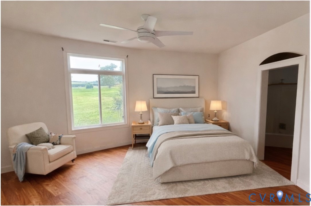 395 Kinsale Creek Road Kinsale, VA 22488 - Photo 19 of 41 a spacious bedroom with a bed and a couch