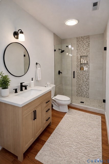 395 Kinsale Creek Road Kinsale, VA 22488 - Photo 22 of 41 a bathroom with a double vanity sink toilet mirror and shower