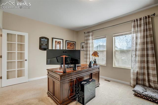 12442 Carmel Ridge Road Colorado Springs, CO 80921 - Photo 26 of 50 Home office with light colored carpet