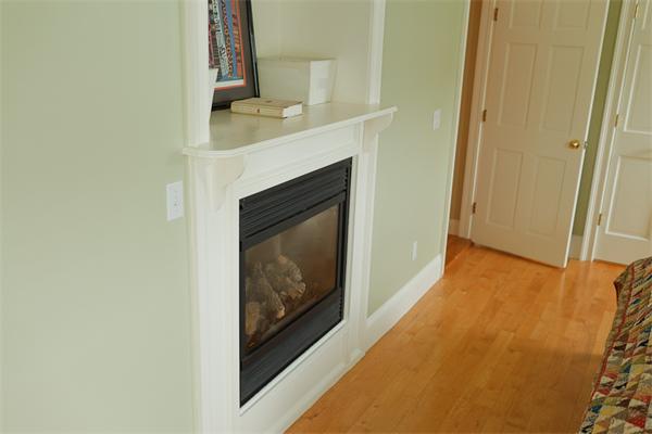141-143 M Street, Unit 2 Boston, MA 02127 - Photo 11 of 15 a hallway with a fireplace