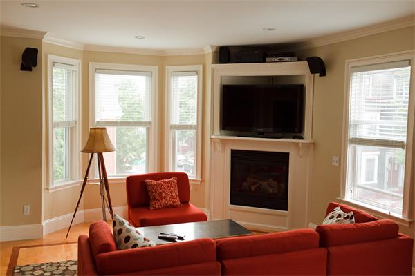 141-143 M Street, Unit 2 Boston, MA 02127 - Photo 4 of 15 a living room with furniture a flat screen tv and a fireplace