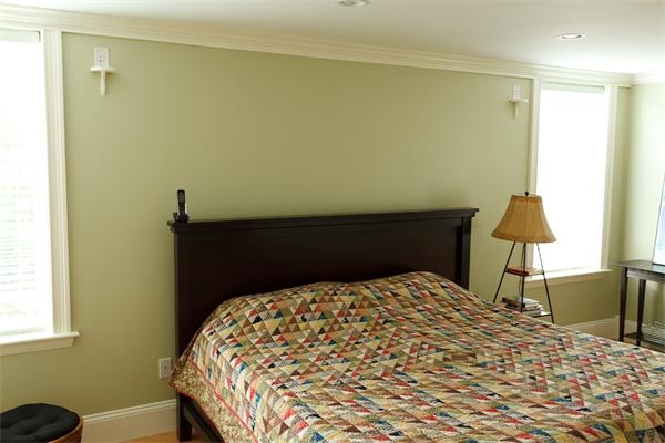 141-143 M Street, Unit 2 Boston, MA 02127 - Photo 8 of 15 a bedroom with a bed and a lamp on the dresser