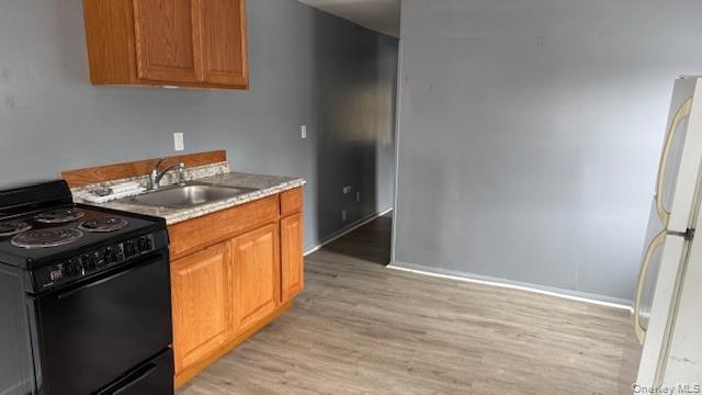 a kitchen with stainless steel appliances granite countertop a stove and a refrigerator