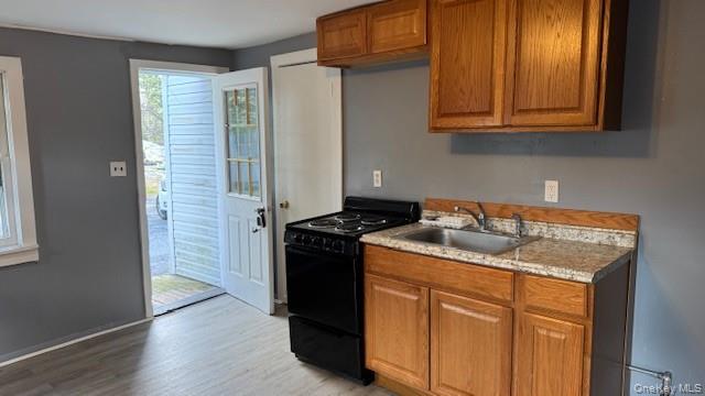 278 Cold Spring Road, Unit 4 Monticello, NY 12701 - Photo 2 of 9 a kitchen with stainless steel appliances granite countertop a sink stove and refrigerator