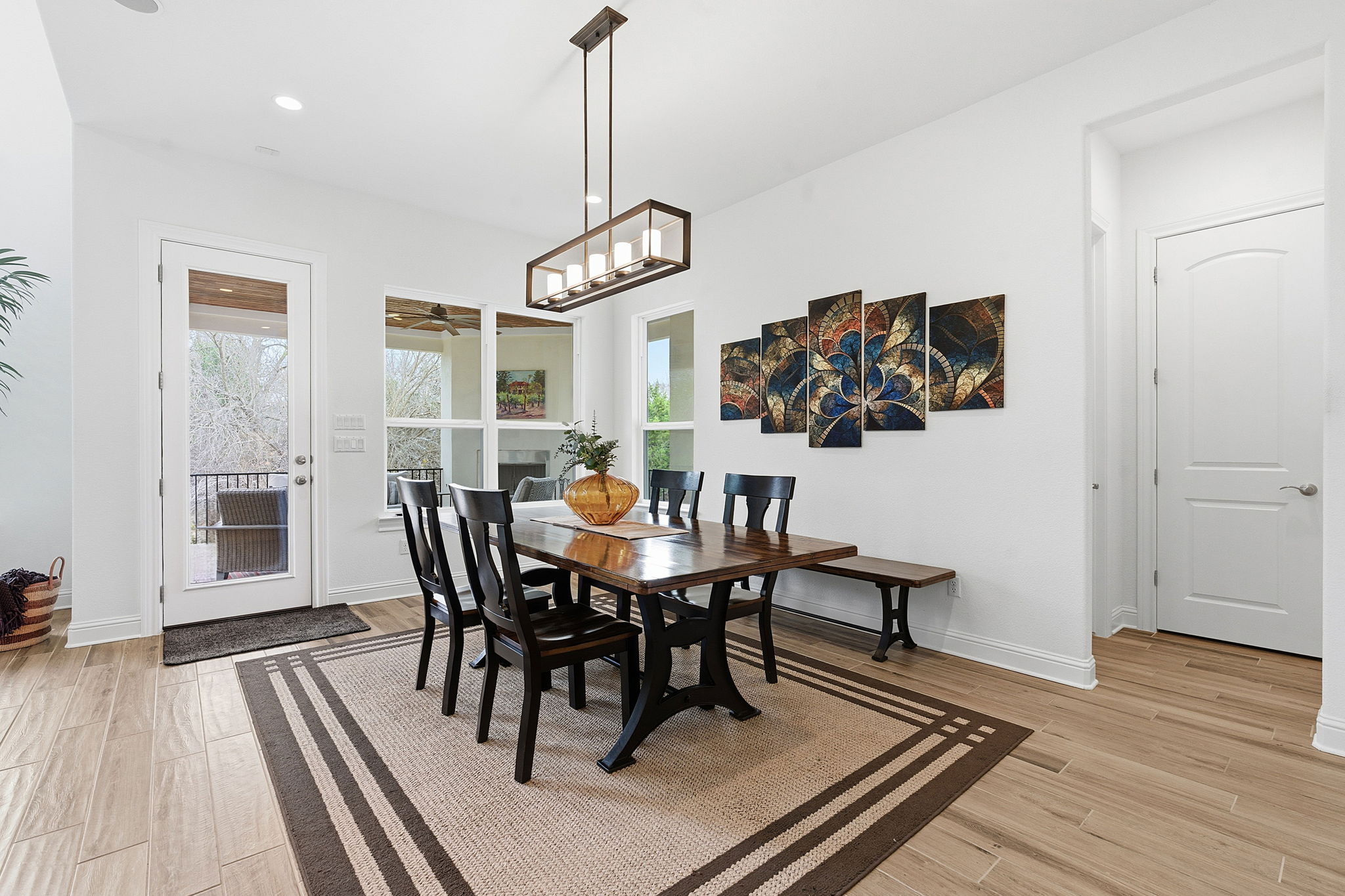 2824 Wedgescale Pass Leander, TX 78641 - Photo 15 of 40 Enjoy meals in the dining area with contemporary lighting overlooking the backyard