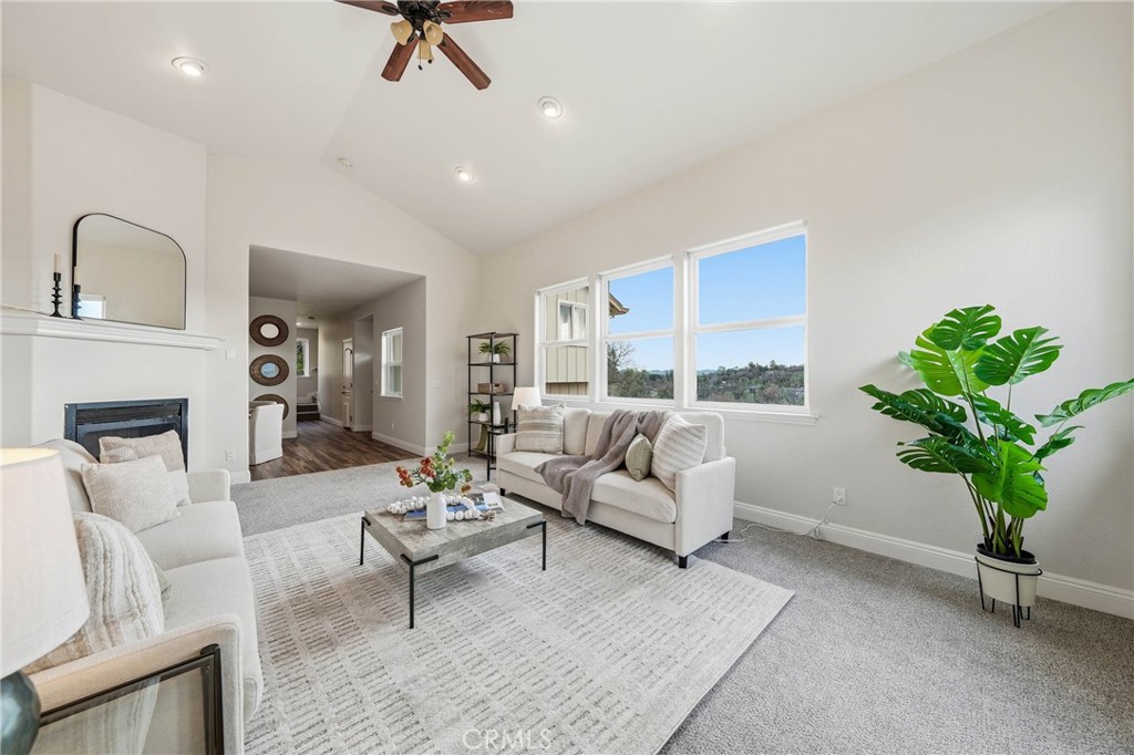 19429 Moon Ridge Road Hidden Valley Lake, CA 95467 - Photo 17 of 75 a living room with furniture a lamp and a potted plant