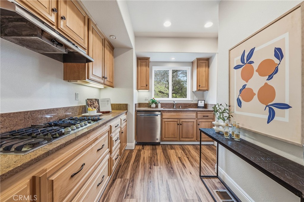 19429 Moon Ridge Road Hidden Valley Lake, CA 95467 - Photo 22 of 75 a kitchen with stainless steel appliances a stove a sink and a microwave
