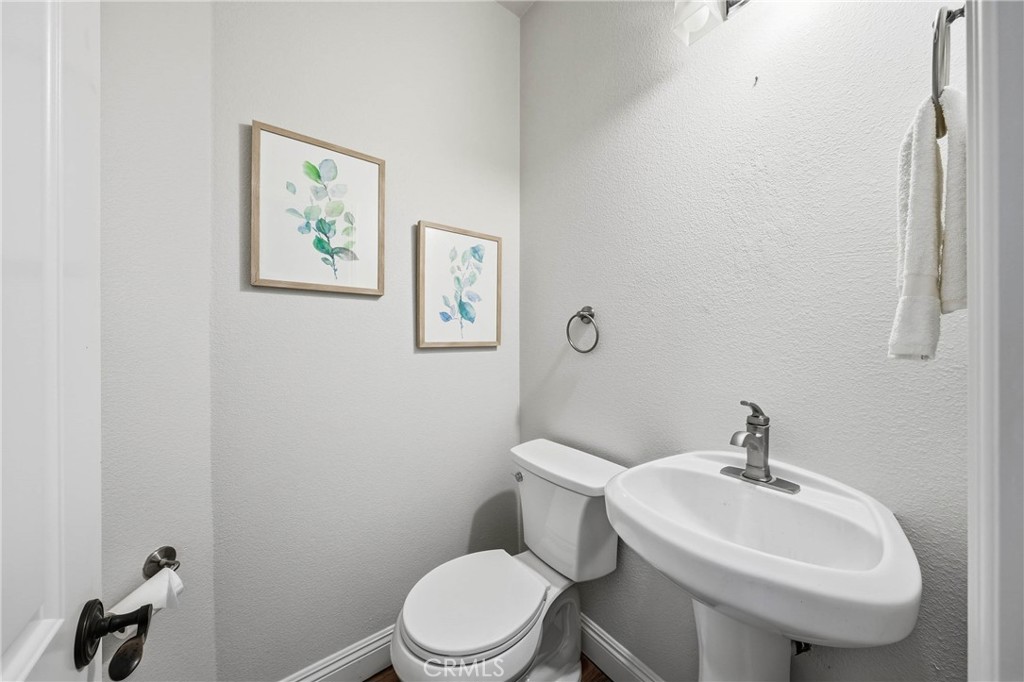 19429 Moon Ridge Road Hidden Valley Lake, CA 95467 - Photo 25 of 75 a white toilet sitting next to a bathroom sink