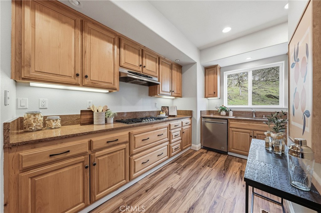 19429 Moon Ridge Road Hidden Valley Lake, CA 95467 - Photo 3 of 75 a kitchen with stainless steel appliances granite countertop a sink a stove and cabinets