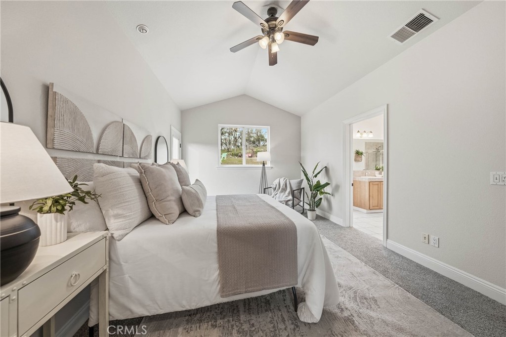 19429 Moon Ridge Road Hidden Valley Lake, CA 95467 - Photo 38 of 75 a living room with furniture and a chandelier