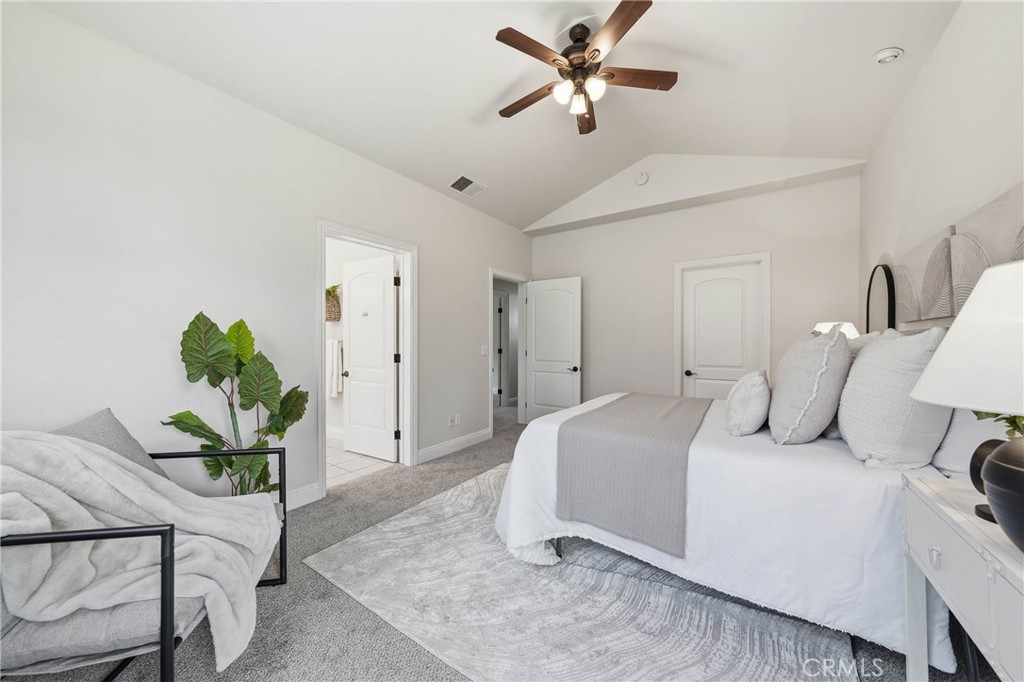 19429 Moon Ridge Road Hidden Valley Lake, CA 95467 - Photo 4 of 75 a bedroom with a bed and a chandelier