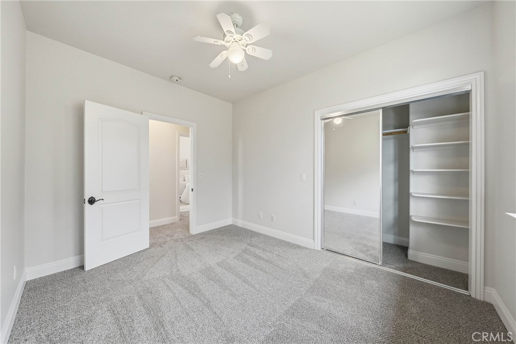 19429 Moon Ridge Road Hidden Valley Lake, CA 95467 - Photo 45 of 75 a view of an empty room with a ceiling fan