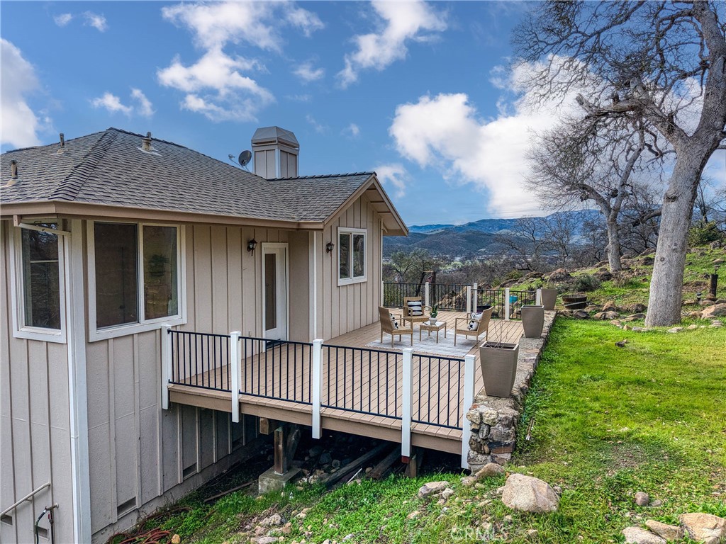 19429 Moon Ridge Road Hidden Valley Lake, CA 95467 - Photo 46 of 75 a view of a house with a small yard and wooden fence