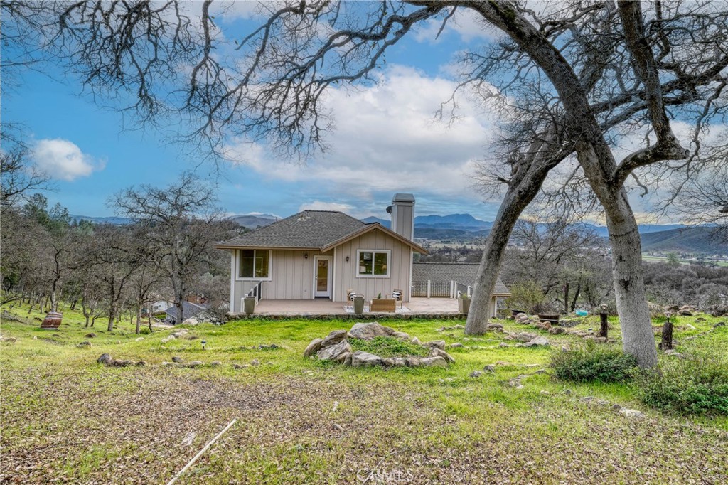 19429 Moon Ridge Road Hidden Valley Lake, CA 95467 - Photo 56 of 75 a front view of a house with a yard