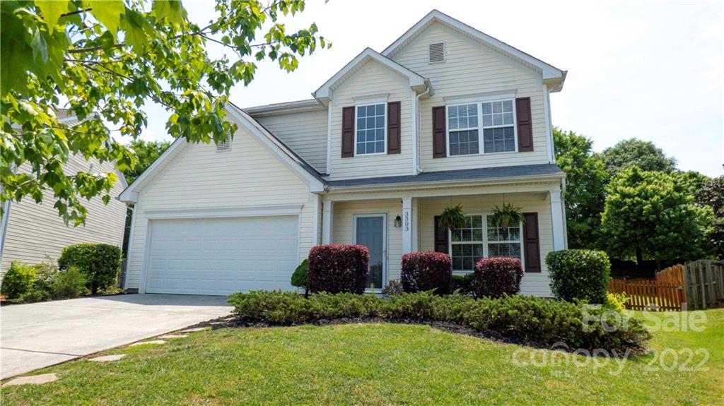 3303 Burnage Hall Road Harrisburg, NC 28075 - Photo 1 of 37 a view of a house with a yard and potted plants