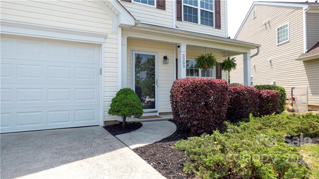 3303 Burnage Hall Road Harrisburg, NC 28075 - Photo 2 of 37 a view of a garden with potted plants