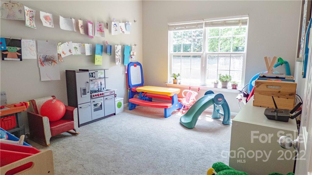 3303 Burnage Hall Road Harrisburg, NC 28075 - Photo 25 of 37 a room with toys and a window