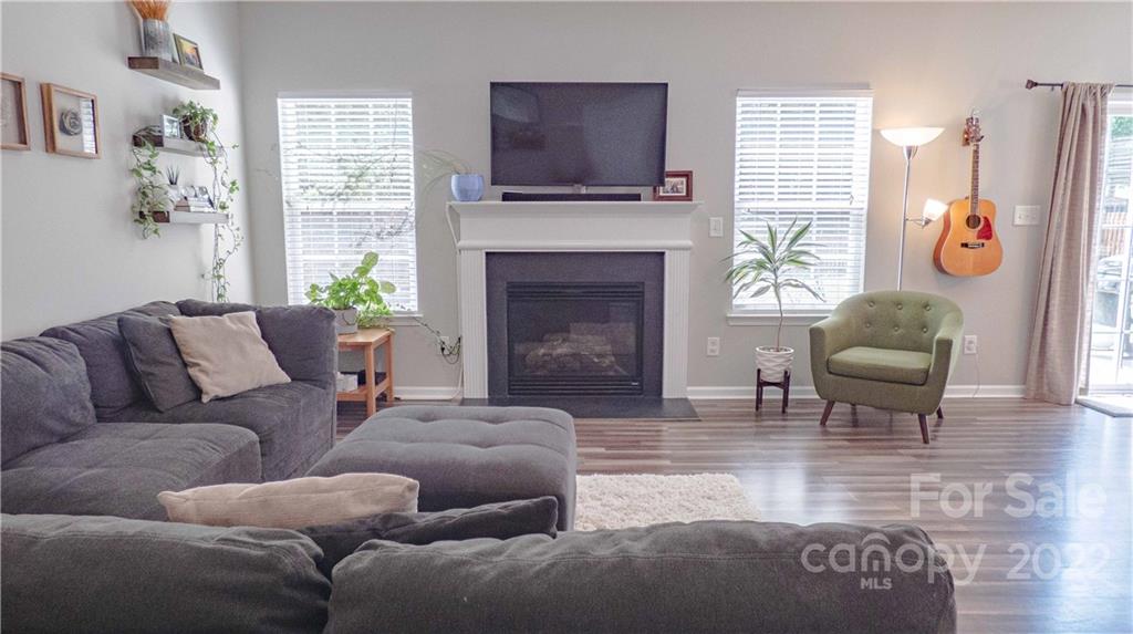 3303 Burnage Hall Road Harrisburg, NC 28075 - Photo 5 of 37 a living room with furniture fireplace and window