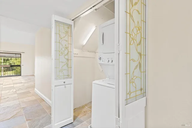 a view of bathroom with a shower and a view of bathroom