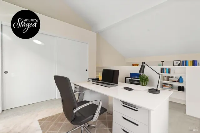 a view of a workspace with furniture