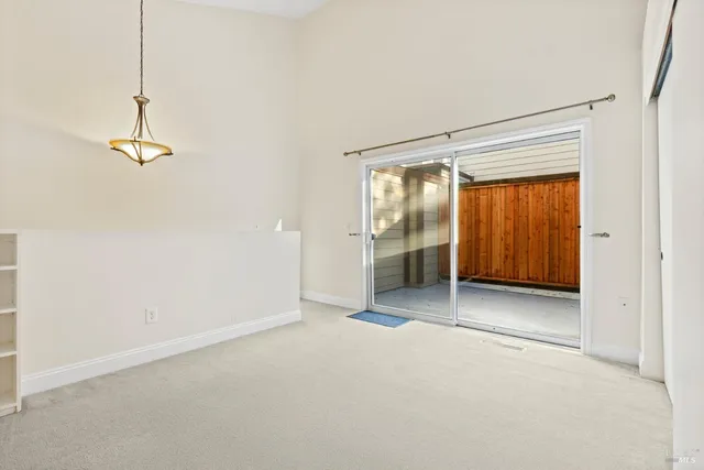 a view of an empty room with a cabinet