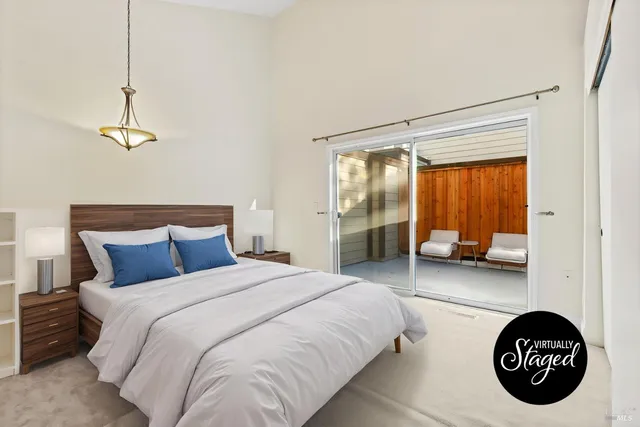 a bedroom with a bed and a couch