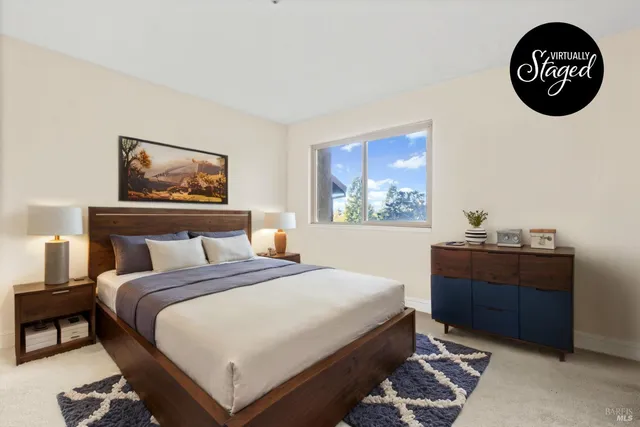 a bedroom with a bed and a cabinet