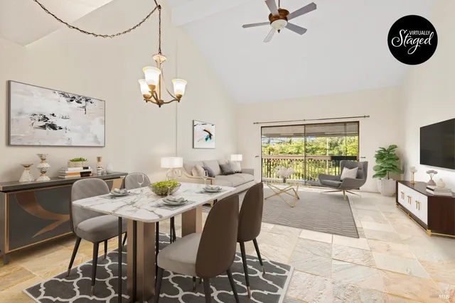 a view of a dining room with furniture wooden floor and a chandelier
