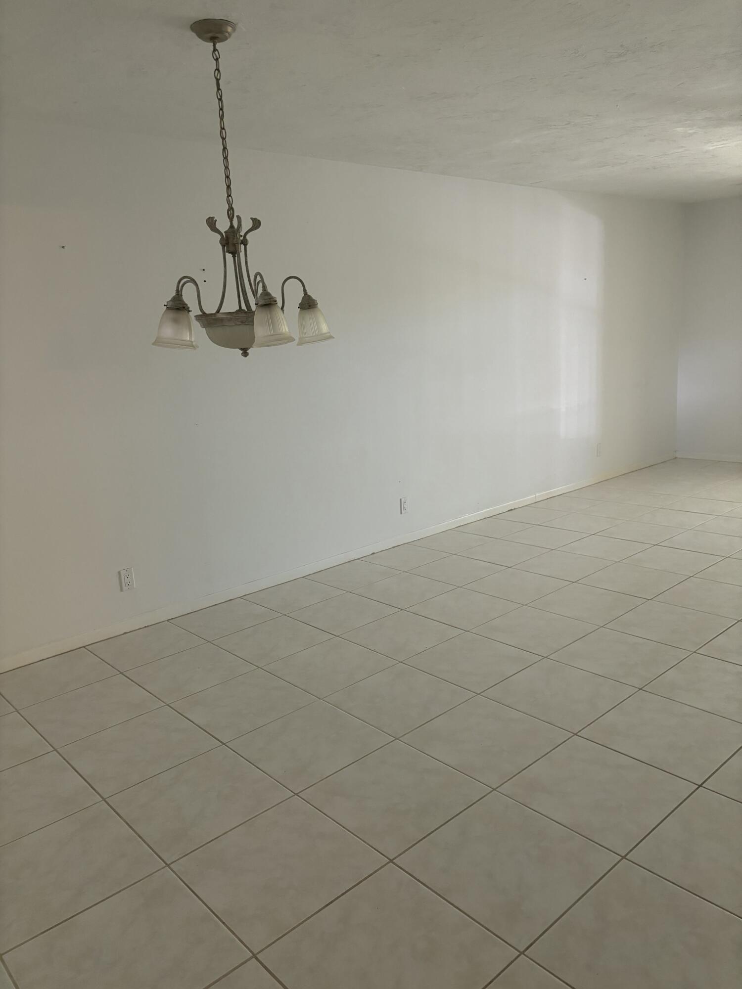 1700 Dover Road, Unit 215A Delray Beach, FL 33445 - Photo 16 of 23 a view of a room with rack on the wall