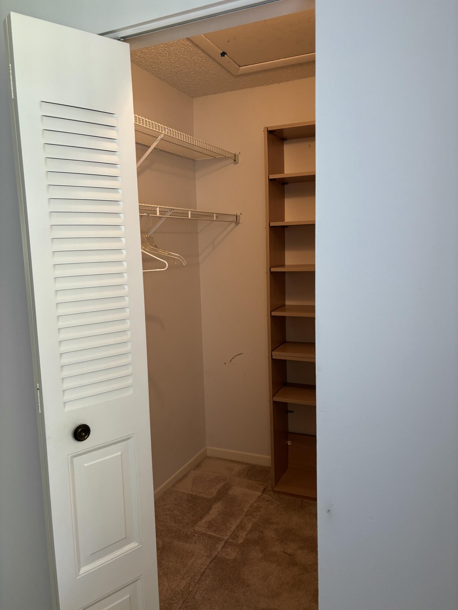 1700 Dover Road, Unit 215A Delray Beach, FL 33445 - Photo 22 of 23 a view of closet area