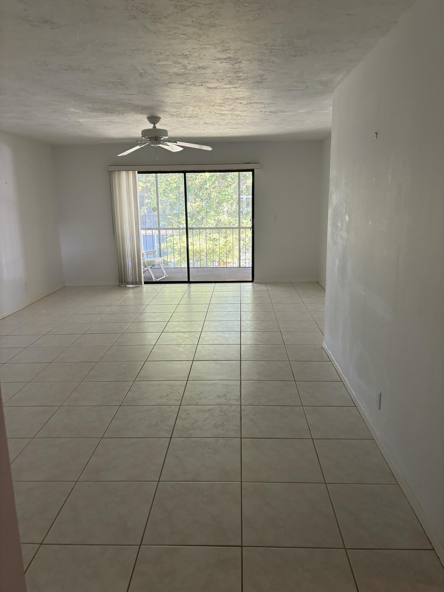 1700 Dover Road, Unit 215A Delray Beach, FL 33445 - Photo 3 of 23 a view of an empty room with a window