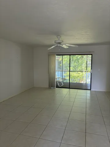 a view of an empty room with a window