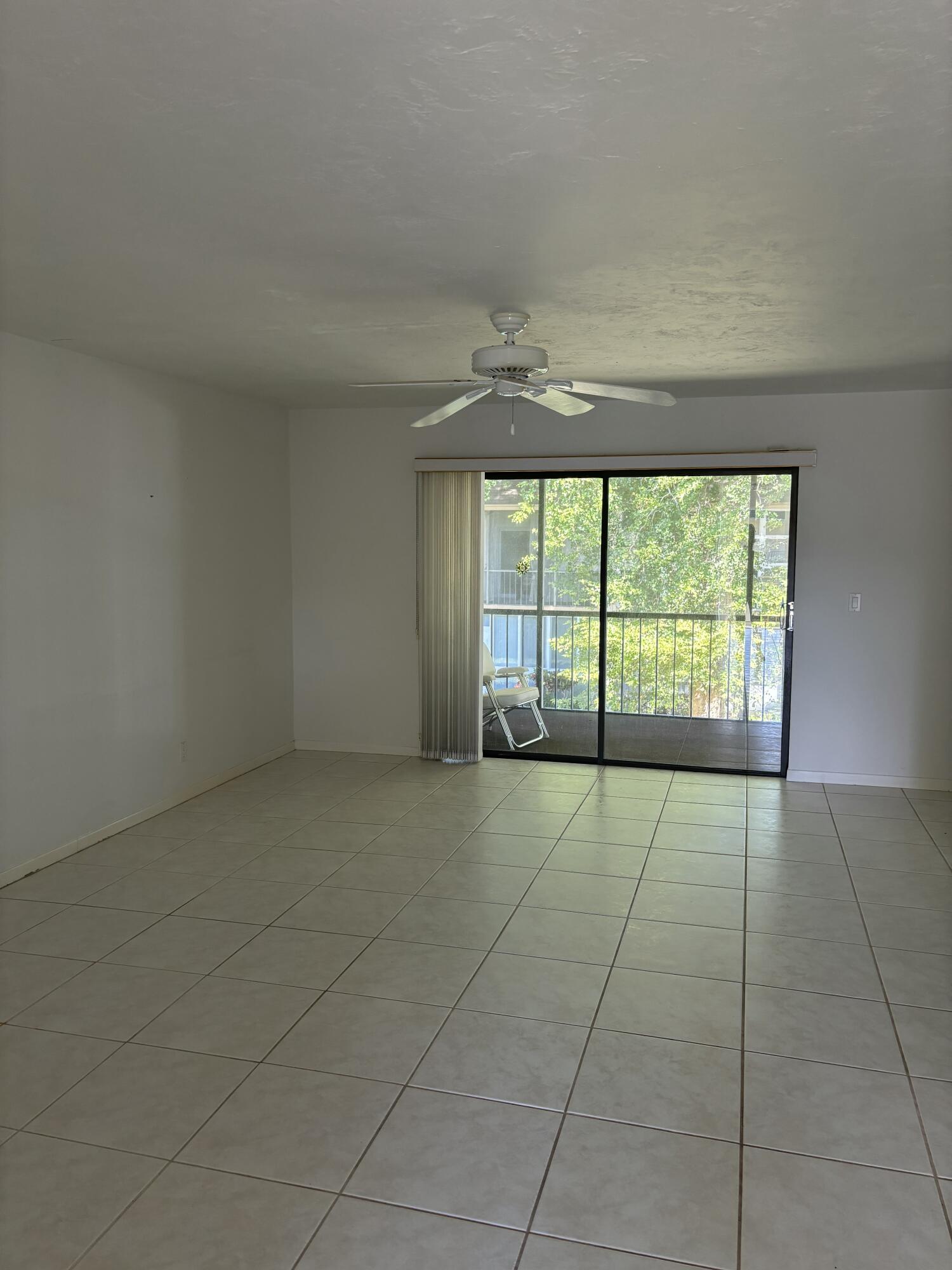 1700 Dover Road, Unit 215A Delray Beach, FL 33445 - Photo 4 of 23 a view of an empty room with a window