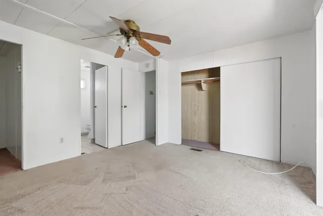 a view of a bathroom from a hallway